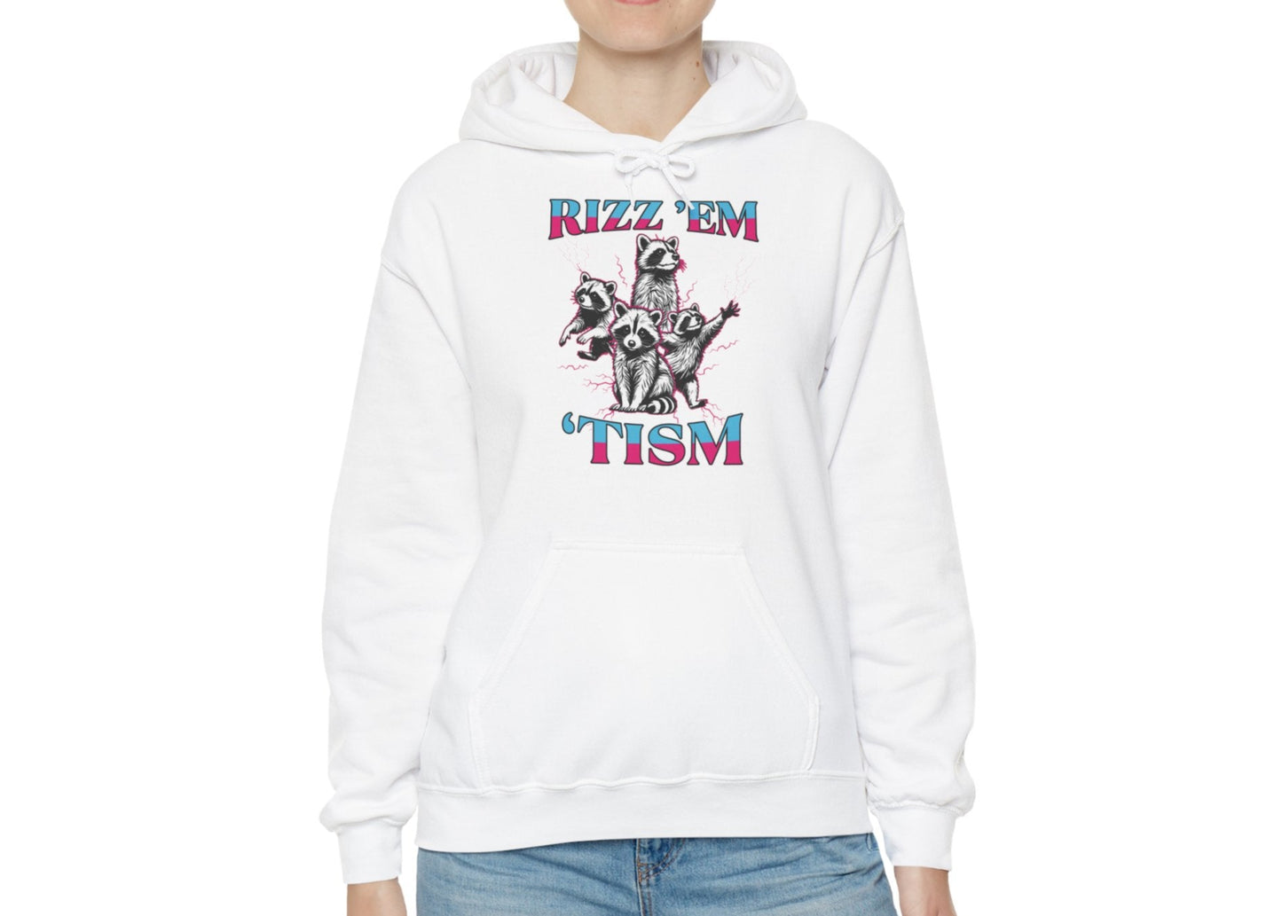 Model wearing a white hoodie with a raccoon illustration and the text "Rizz 'Em 'Tism," standing with hands at sides. Part of the Vivid Divergence Sensory Friendly Unisex Hoodie Range.