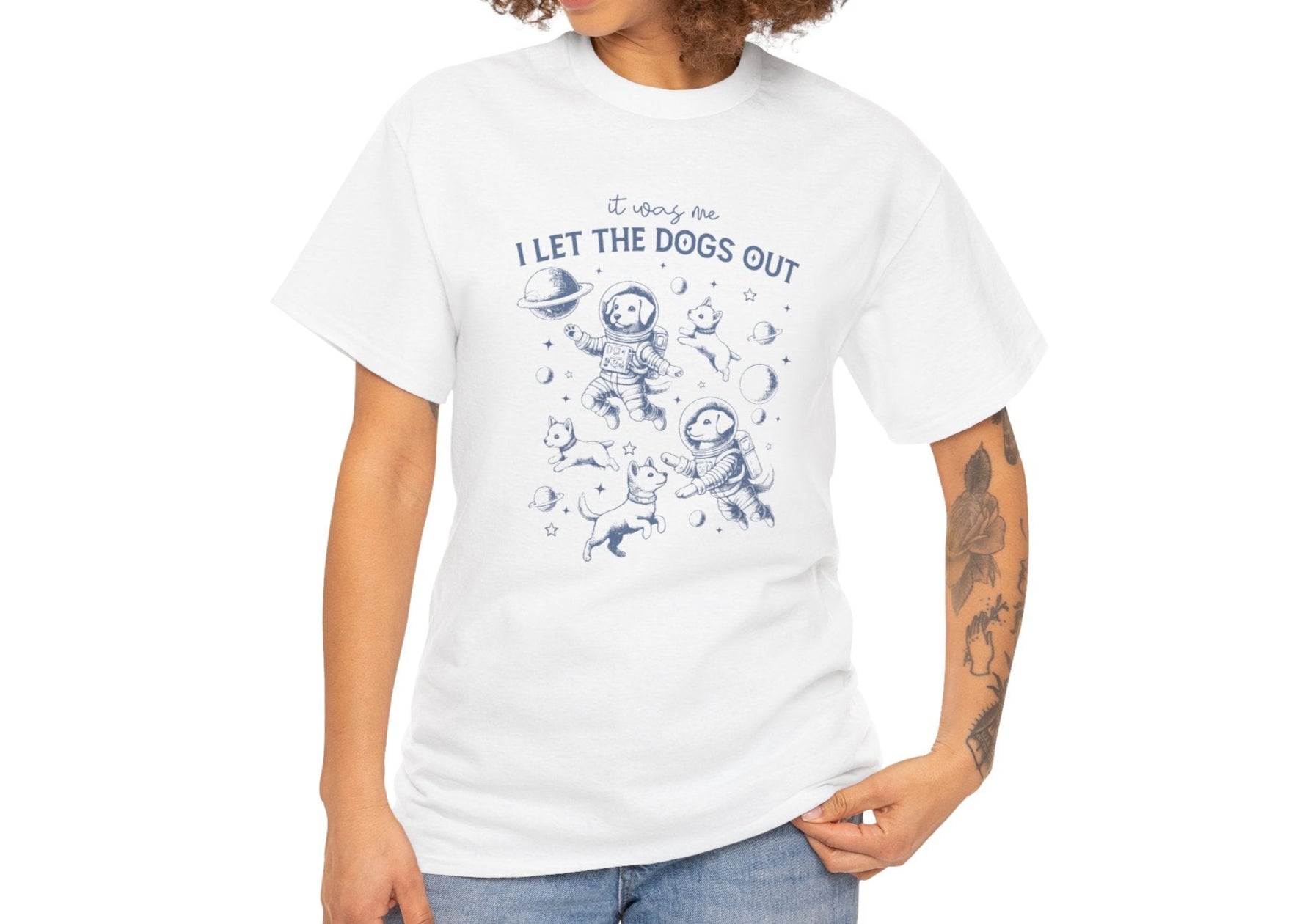 Front view of a white T-shirt featuring astronaut dogs in space suits with playful text. Part of the Vivid Divergence Sensory Friendly Unisex Tees Range.