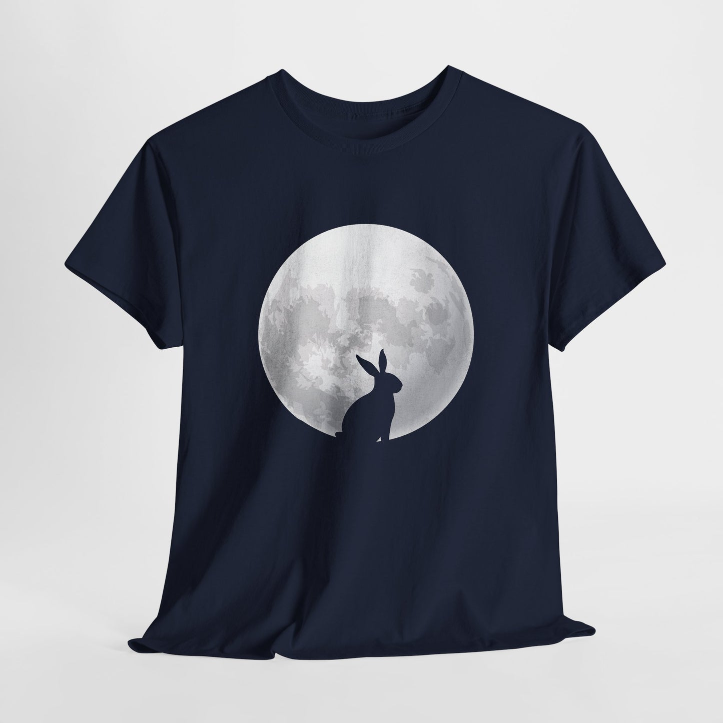 Navy blue T-shirt hanging, showcasing a mysterious rabbit silhouette against a luminous full moon, an elegant and cosmic Easter design. Hop into the season in style and shop Easter shirts online today!