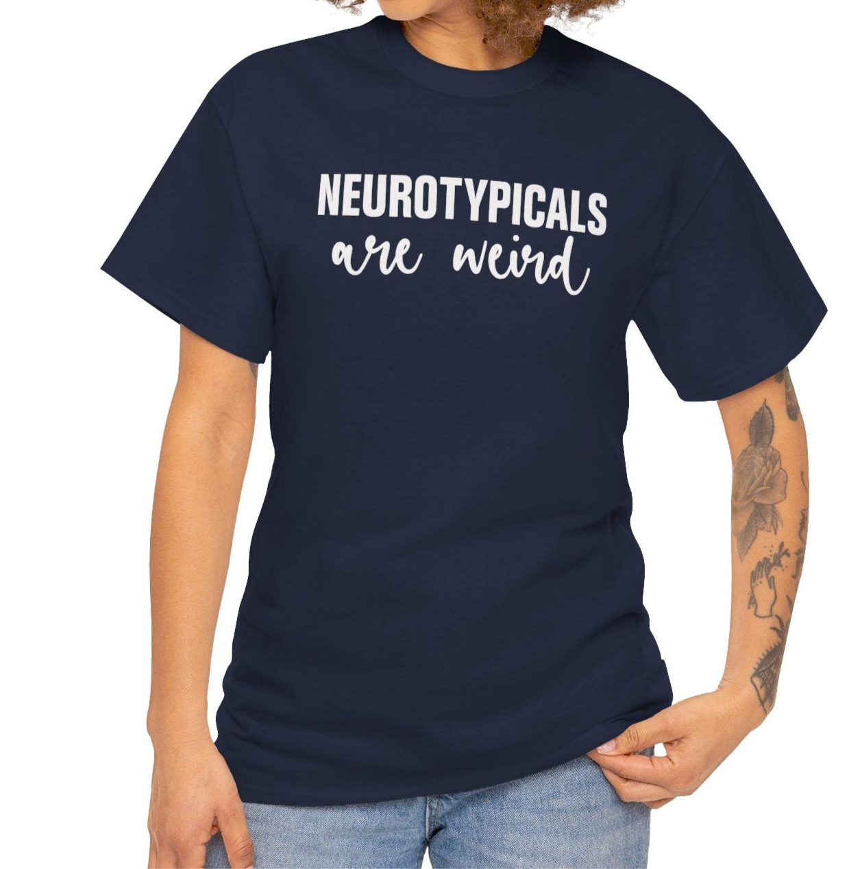 Model wearing a navy T-shirt with "Neurotypicals Are Weird" in bold white text. Part of the Vivid Divergence Sensory Friendly Unisex Tees Range.