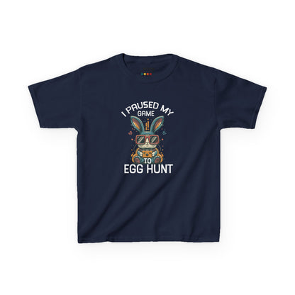 Navy blue kids' T-shirt showcasing "I Paused My Game to Egg Hunt" with a fun gaming-style bunny, a great Easter choice for gamers. Hop into the season in style and shop Easter shirts online today!