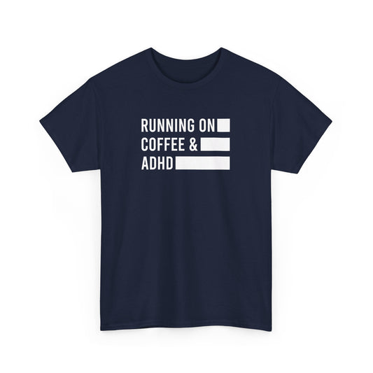 Front view of a navy T-shirt with "Running on Coffee & ADHD" in bold white text. Part of the Vivid Divergence Sensory Friendly Unisex Tees Range.