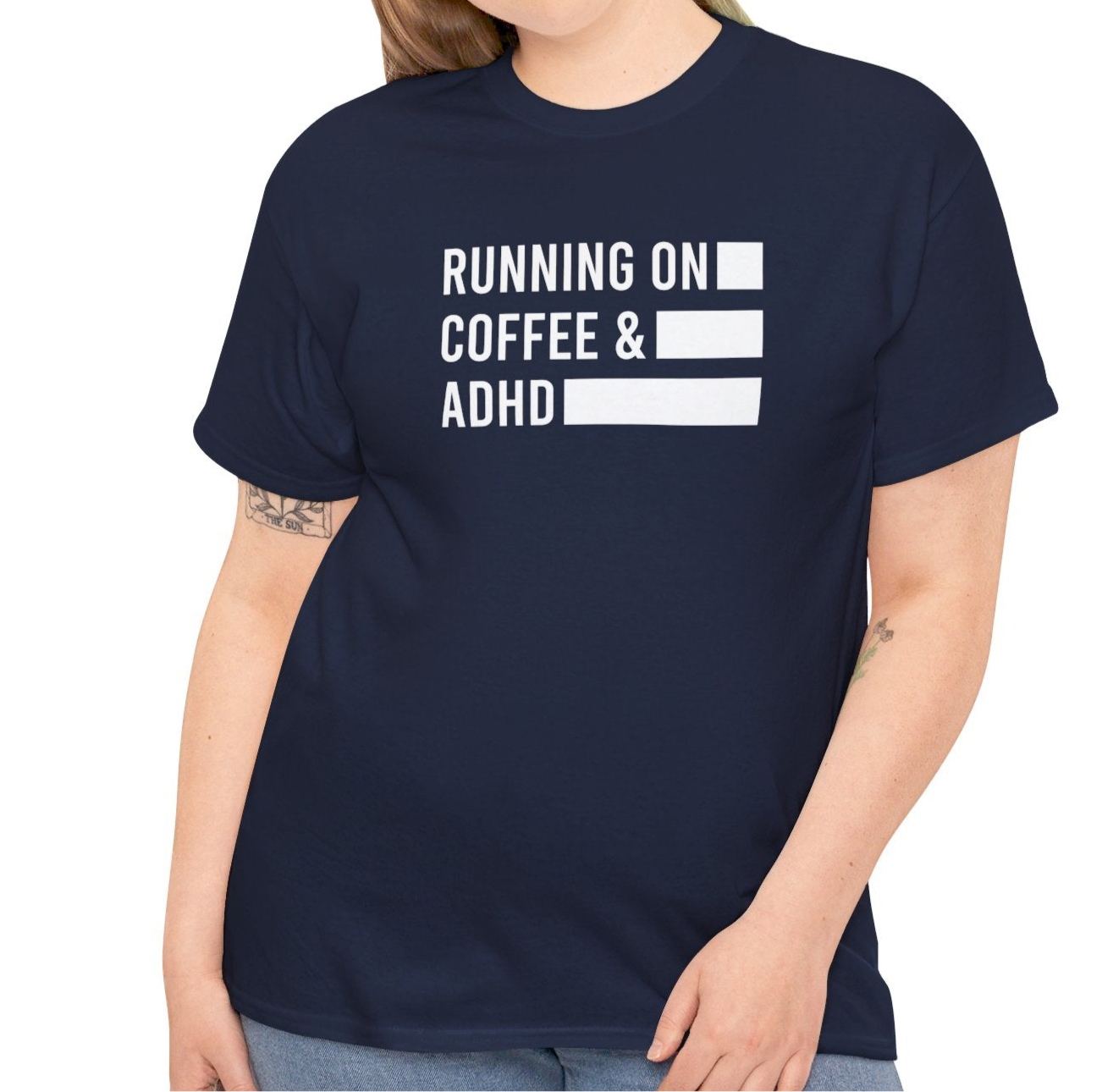 Model wearing a navy T-shirt with "Running on Coffee & ADHD" in bold white text. Part of the Vivid Divergence Sensory Friendly Unisex Tees Range.