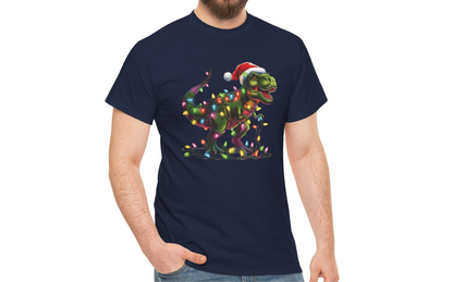 Model wearing a navy blue T-shirt featuring a festive T-Rex wrapped in Christmas lights with a Santa hat. Part of the Vivid Divergence Sensory Friendly Unisex Tees Range.