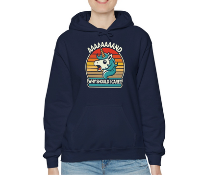 Model wearing a navy hoodie with a "Aaaaand Why Should I Care?" text and unicorn rainbow retro graphic. Part of the Vivid Divergence Sensory Friendly Unisex Hoodie Range.