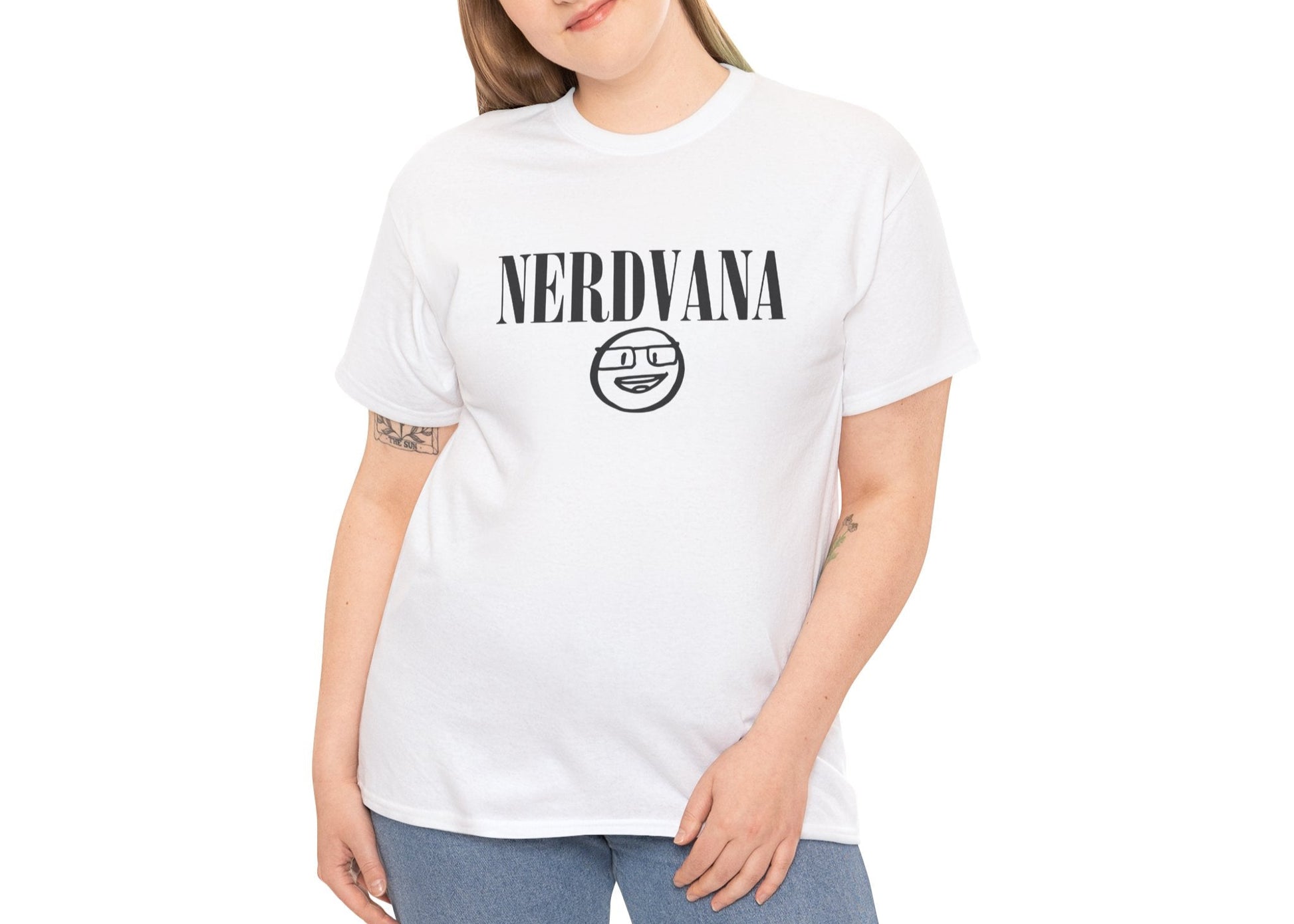 Modeled view of white T-shirt with bold black text reading “NERDVANA” above a circular parody logo combining geek symbols and grunge vibes. For fans of riffs and references. Part of the Vivid Divergence Memewear Collection!
