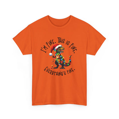 Front view of an orange T-shirt featuring a festive illustration of a dinosaur tangled in Christmas lights with the text "I’m Fine. This is Fine. Everything is Fine." Part of the Vivid Divergence Sensory Friendly Unisex Tees Range.