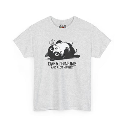 Front view of light grey T-shirt featuring black line art of a wide-eyed cat surrounded by scribbles, with the phrase "Overthinking and also hungry." A whole vibe. Part of the Vivid Divergence Memewear Collection!