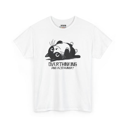 Front view of white T-shirt featuring black line art of a wide-eyed cat surrounded by scribbles, with the phrase "Overthinking and also hungry." A whole vibe. Part of the Vivid Divergence Memewear Collection!
