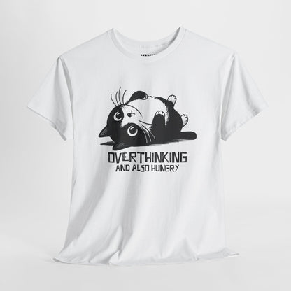 Hanging view of white T-shirt featuring black line art of a wide-eyed cat surrounded by scribbles, with the phrase "Overthinking and also hungry." A whole vibe. Part of the Vivid Divergence Memewear Collection!

