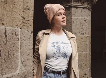  A person wearing a white T-shirt featuring astronaut dogs in space suits with playful text, styled in an outdoor setting. Part of the Vivid Divergence Sensory Friendly Unisex Tees Range.