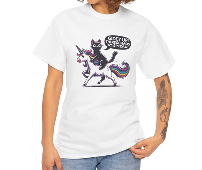 Person wearing a white T-shirt with a black cat riding a unicorn and the text "Giddy Up, There's Chaos to Spread." Part of the Vivid Divergence Sensory Friendly Unisex Tees Range.
