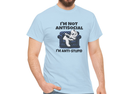 A person wearing a light blue T-shirt with a graphic of a cat on a couch and the text "I'm Not Anti-Social, I'm Anti-Stupid." Part of the Vivid Divergence Sensory Friendly Unisex Tees Range.