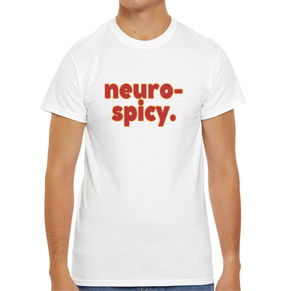  A person wearing a white T-shirt with the text "Neuro-Spicy" in retro-style lettering. Part of the Vivid Divergence Sensory Friendly Unisex Tees Range.