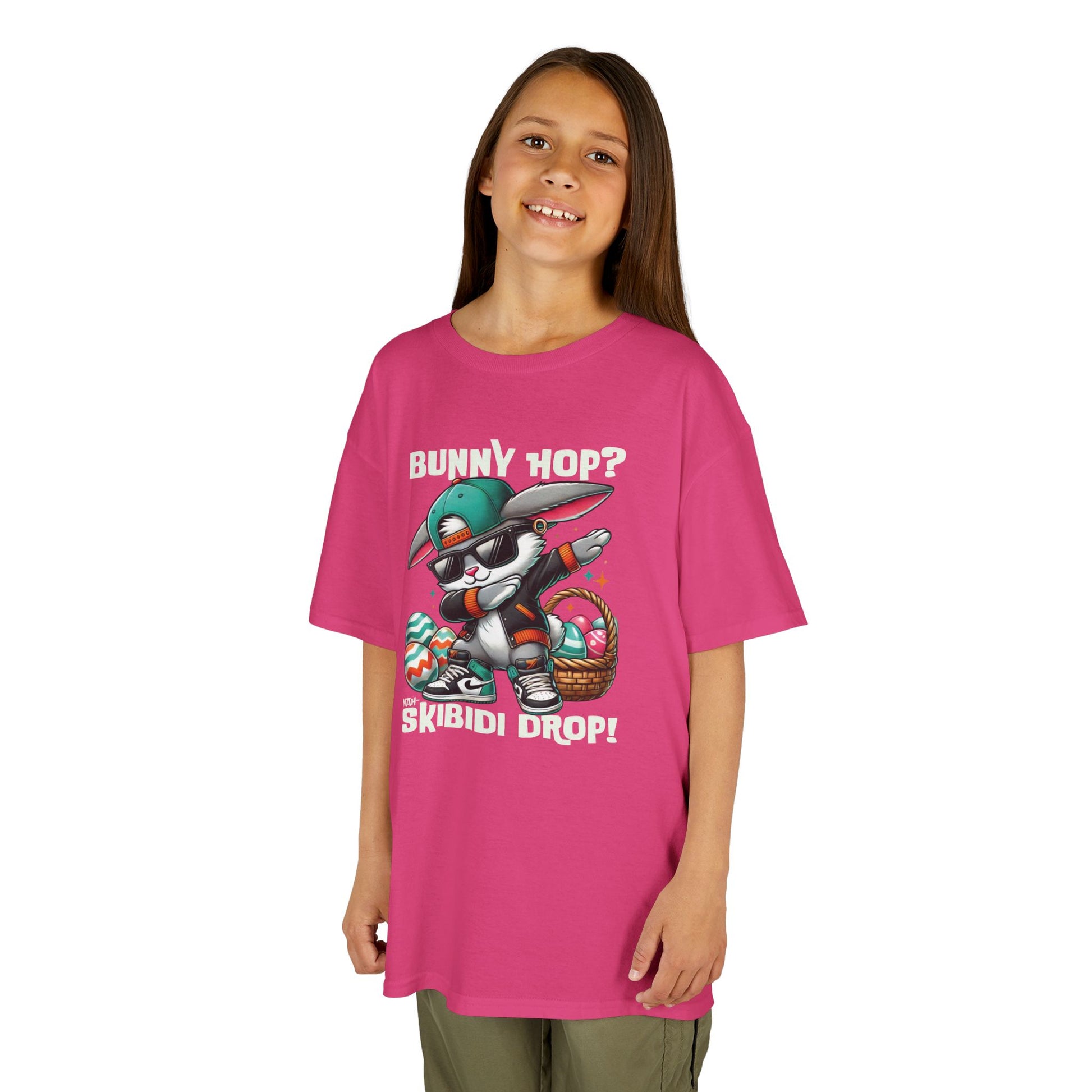 Pink skibidi Easter bunny shirt modeled by a girl, youth sizing. A fun, bold shirt radiating skibidi sigma rizz energy for Easter. Hop into the season in style and shop Easter shirts online today!
