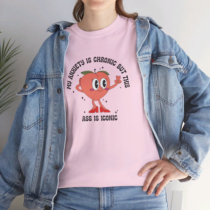 Close-up of a person wearing a pink T-shirt with the text "My Anxiety Is Chronic But This Ass Is Iconic" paired with a denim jacket. Part of the Vivid Divergence Sensory Friendly Unisex Tees Range.