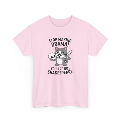 Hanging front view of a pink T-shirt featuring a cute cat holding a skull and text that reads "Stop Making Drama! You Are Not Shakespeare." Part of the Vivid Divergence Sensory Friendly Unisex Tees Range.