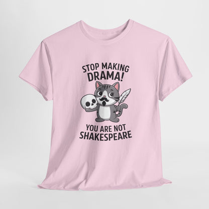Hanging front view of a pink T-shirt featuring a cute cat holding a skull and text that reads "Stop Making Drama! You Are Not Shakespeare." Part of the Vivid Divergence Sensory Friendly Unisex Tees Range.