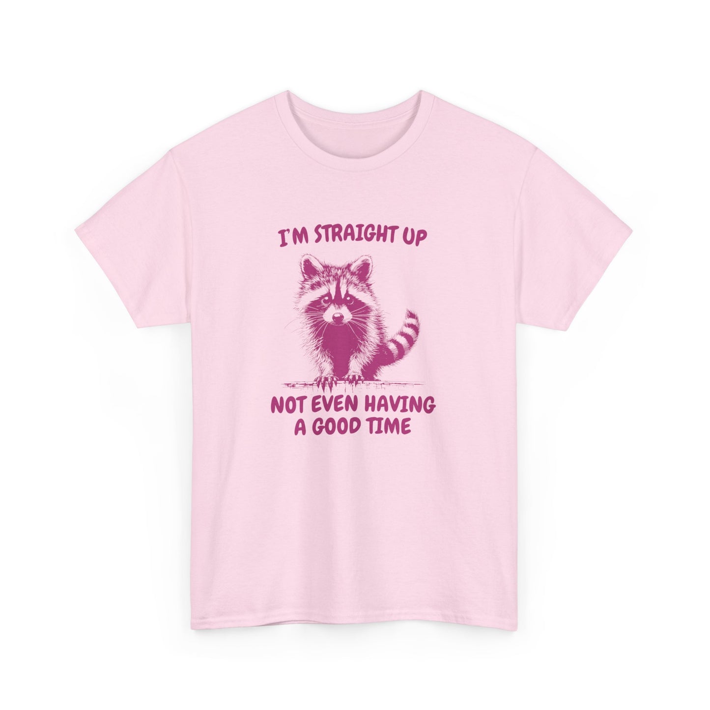 Front view of a pink T-shirt featuring a distressed raccoon graphic with the text "I'm Straight Up Not Even Having a Good Time." Part of the Vivid Divergence Sensory Friendly Unisex Tees Range.
