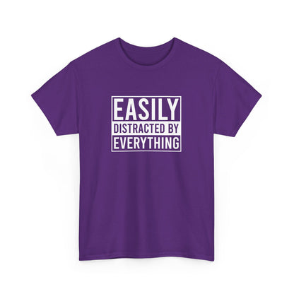 Front view of a purple T-shirt with the text "Easily Distracted by Everything" in bold white letters. Part of the Vivid Divergence Sensory Friendly Unisex Tees Range.