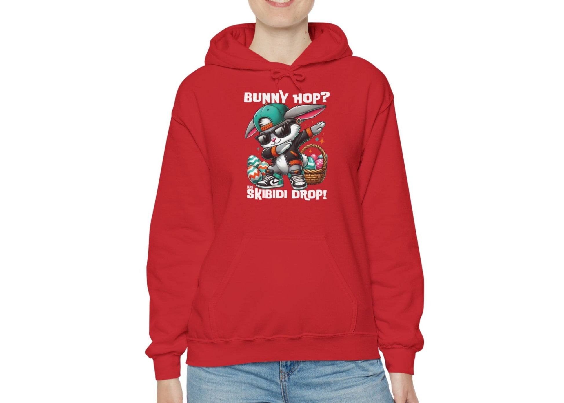 Woman in red hoodie with Dabbing Bunny Hop Skibidi Drop Easter print. Part of the Vivid Divergence Sensory Friendly Unisex Hoodies Range.