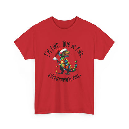 Front view of a red T-shirt featuring a festive illustration of a dinosaur tangled in Christmas lights with the text "I’m Fine. This is Fine. Everything is Fine." Part of the Vivid Divergence Sensory Friendly Unisex Tees Range.