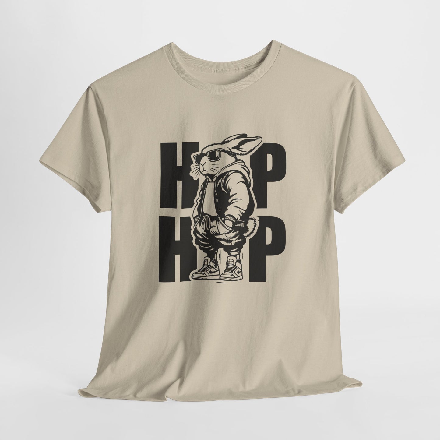 Sand T-shirt hanging, decorated with a bold hip-hop bunny and "HOP HOP" text, an edgy and fun Easter pick. Hop into the season in style and shop Easter shirts online today!