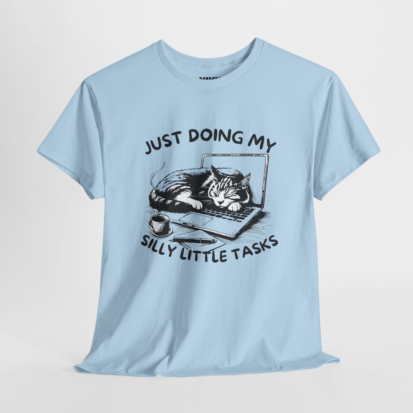 Light blue meme T-shirt with laptop cat graphic hanging on a hanger. Doing the least in the cutest way. Part of the Vivid Divergence Memewear Collection!
