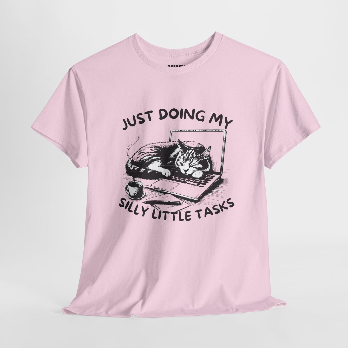 Light Pink meme T-shirt with laptop cat graphic hanging on a hanger. Doing the least in the cutest way. Part of the Vivid Divergence Memewear Collection!