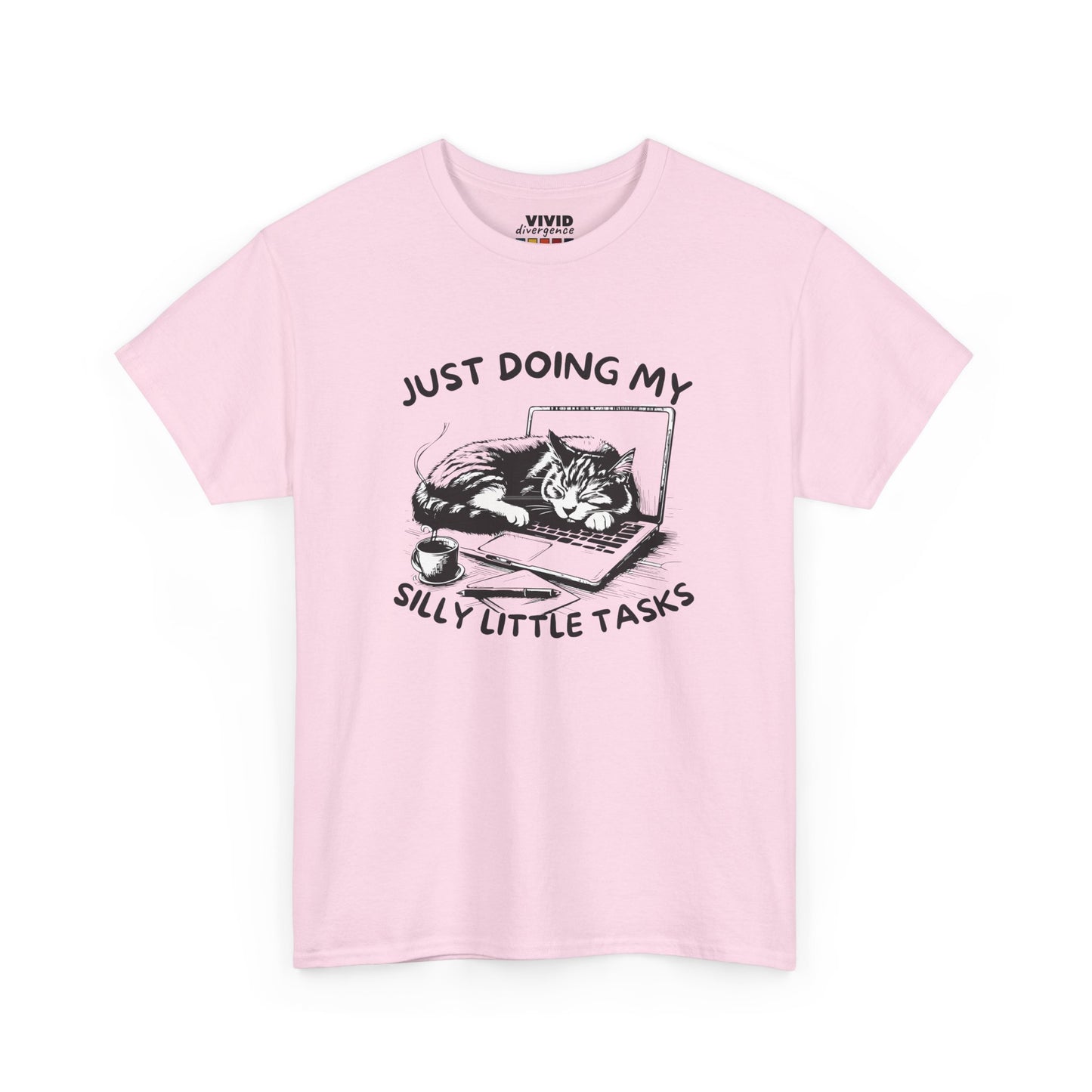 Front view of pastel pink T-shirt featuring cat-on-laptop design with hand-drawn charm. Soft, cozy procrastination energy. Part of the Vivid Divergence Memewear Collection!
