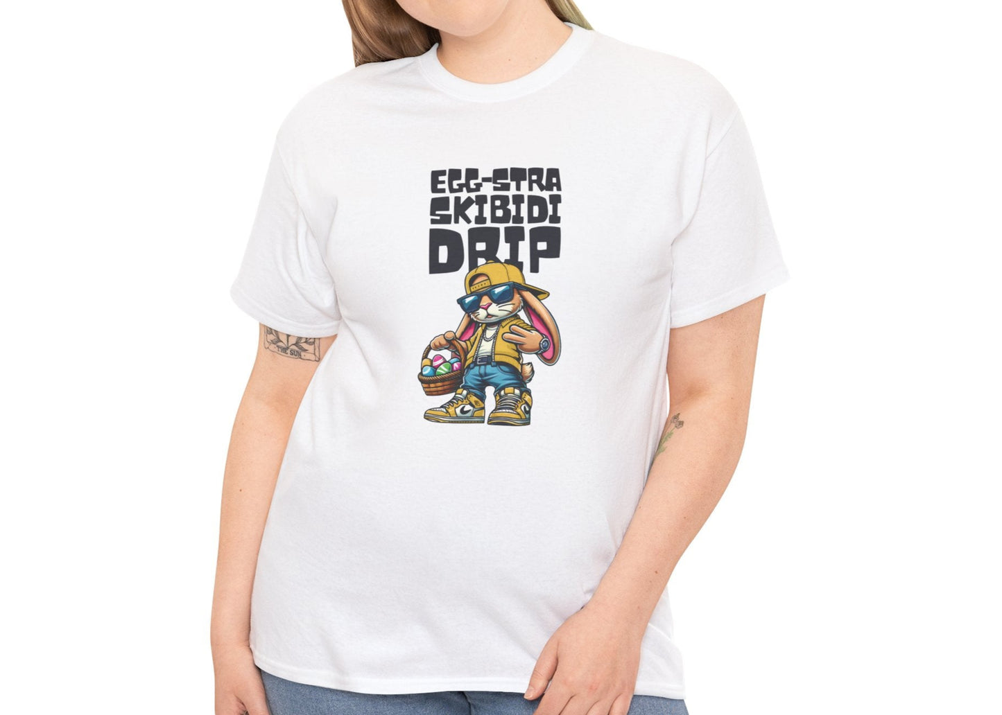 Modeled view of a white Skibidi Drip Easter T-shirt showcasing an Easter bunny flexing swag with "Eggstra Skibidi Drip" text. The perfect viral meme tee for Easter. Part of the Vivid Divergence Sensory Friendly Unisex Tees Range.
