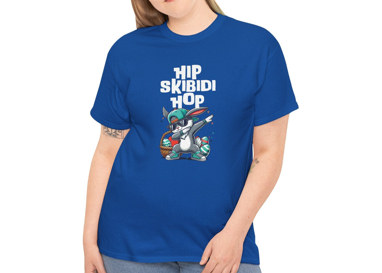 Modeled view of a royal blue skibidi Easter T-shirt featuring a dabbing bunny and "Hip Skibidi Hop" text. A trendy, meme-worthy skibidi sigma rizz tee. Part of the Vivid Divergence Sensory Friendly Unisex Tees Range.