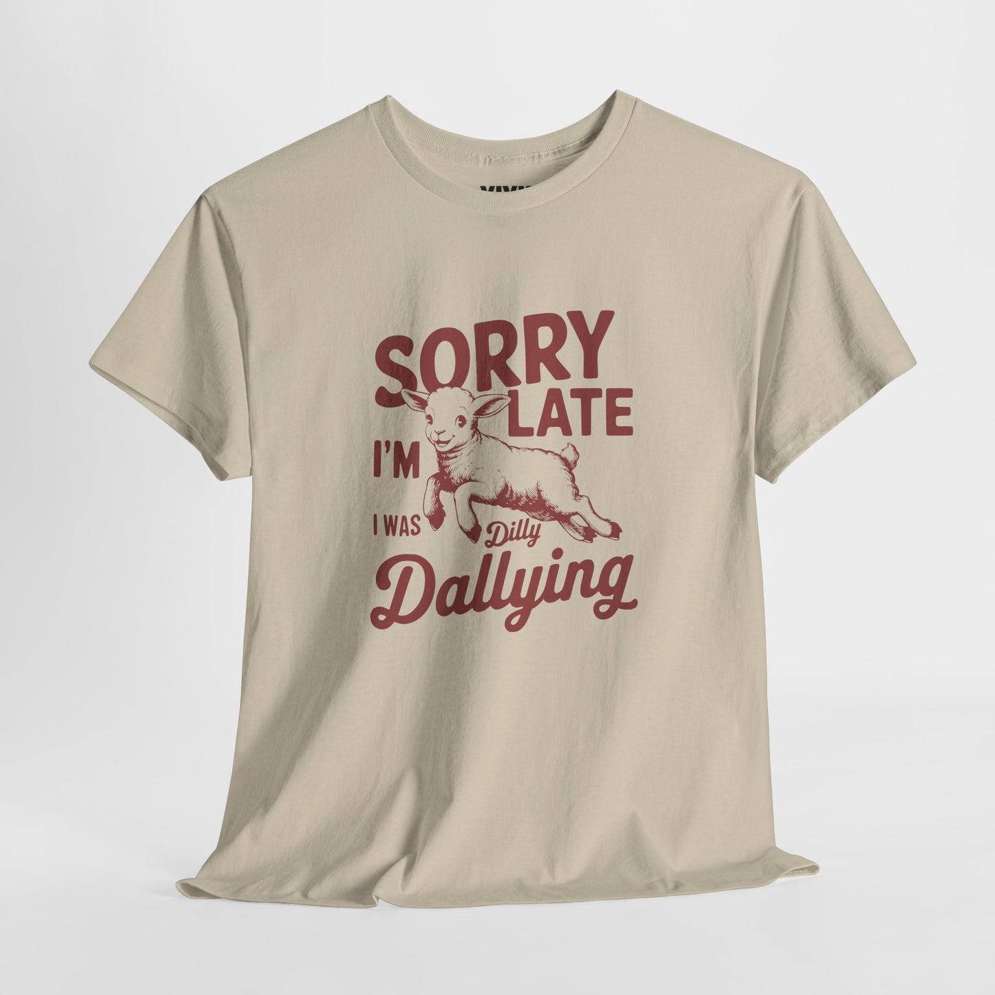Hanging view of beige T-shirt with red vintage-style text that reads "Sorry I'm Late I Was Dilly Dallying." For the charmingly unhurried. Part of the Vivid Divergence Memewear Collection!
