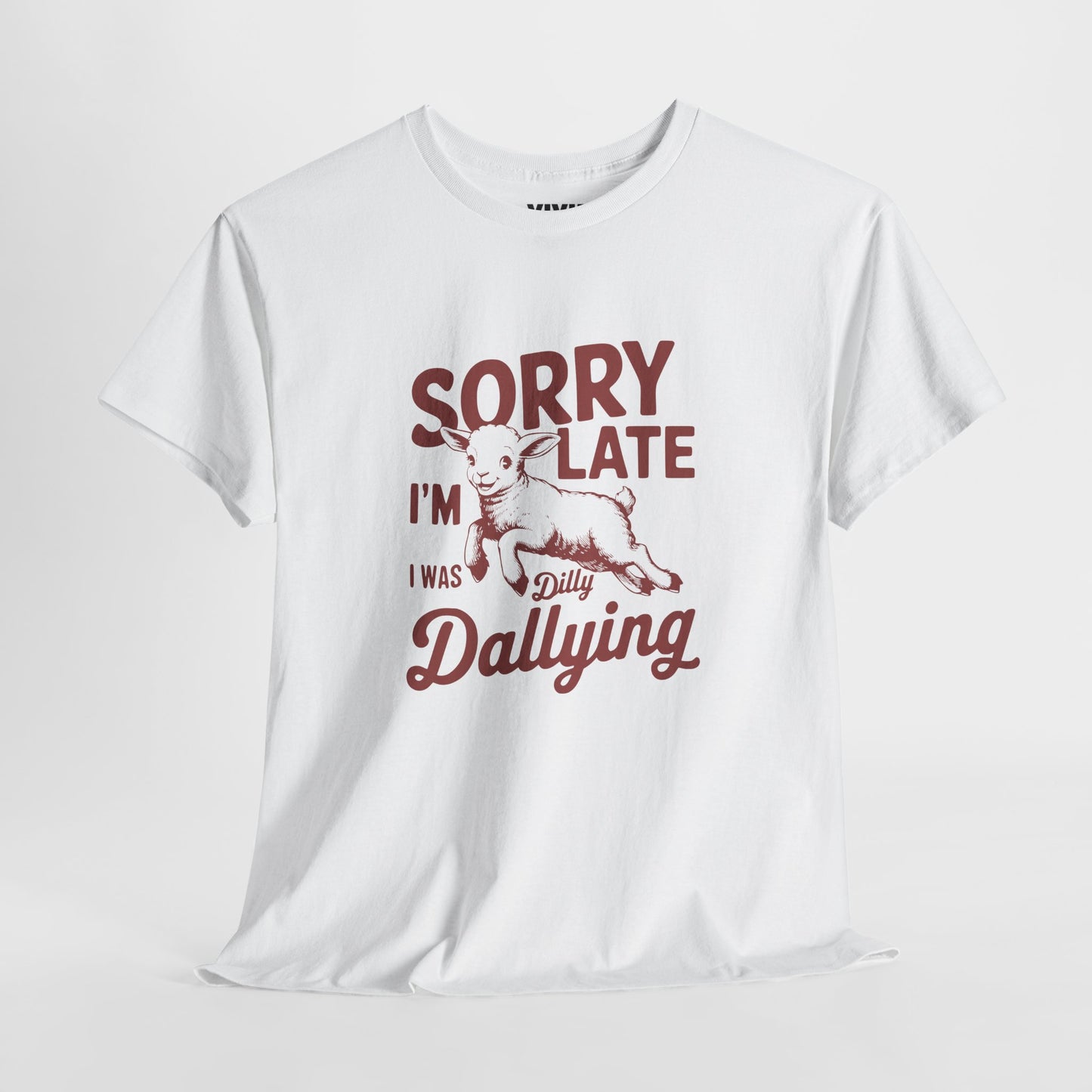 Hanging view of white T-shirt with red vintage-style text that reads "Sorry I'm Late I Was Dilly Dallying." For the charmingly unhurried. Part of the Vivid Divergence Memewear Collection!
