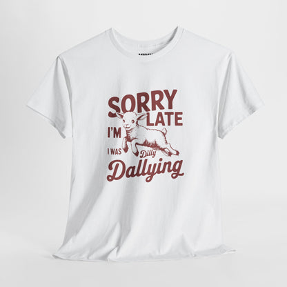 Hanging view of white T-shirt with red vintage-style text that reads "Sorry I'm Late I Was Dilly Dallying." For the charmingly unhurried. Part of the Vivid Divergence Memewear Collection!
