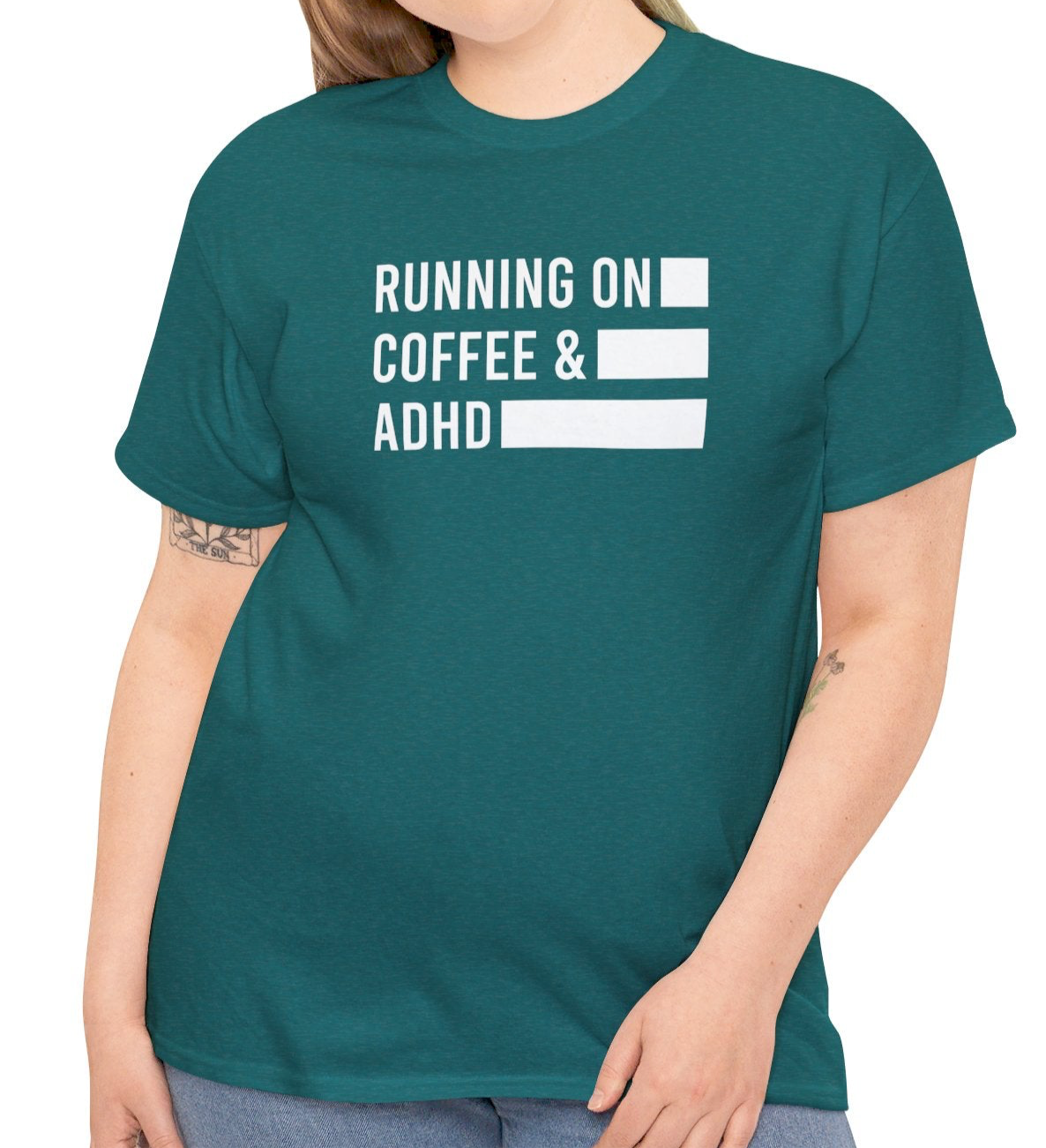 Model wearing a teal T-shirt with "Running on Coffee & ADHD" in bold white text. Part of the Vivid Divergence Sensory Friendly Unisex Tees Range.