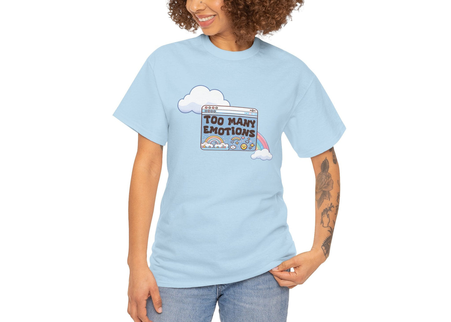 Modeled view of light blue T-shirt with retro rainbow-and-window design reading “Too Many Emotions.” Mentally buffering with style. Part of the Vivid Divergence Memewear Collection!