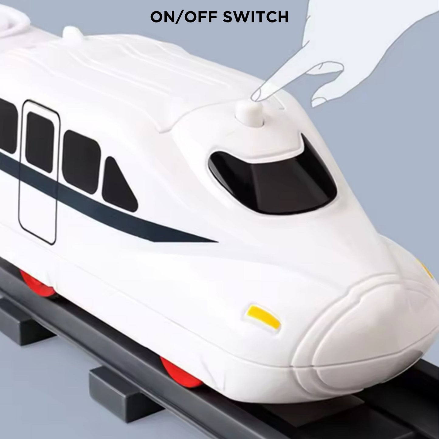 Close-up of the battery compartment on the Tasty Tracks train, demonstrating the quick on/off switch operation.