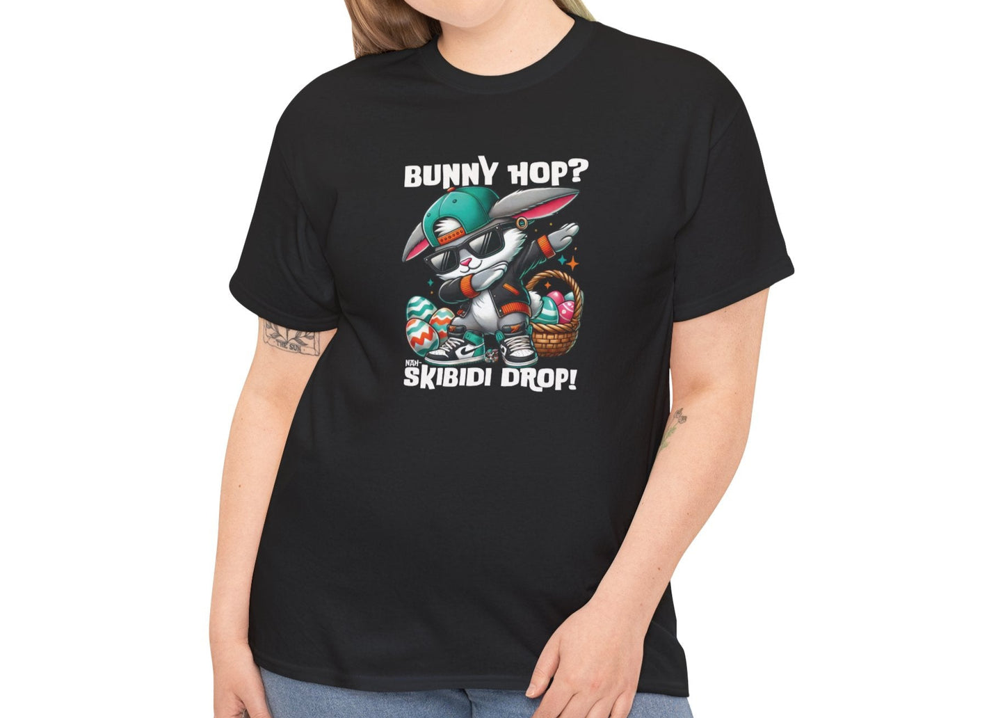 Modeled view of a viral meme-inspired T-shirt in black. A sleek, eye-catching shirt with a dabbing Easter bunny and "Bunny Hop? Nah, Skibidi Drop!" text. Packed with viral skibidi sigma rizz energy. Part of the Vivid Divergence Sensory Friendly Unisex Tees Range.