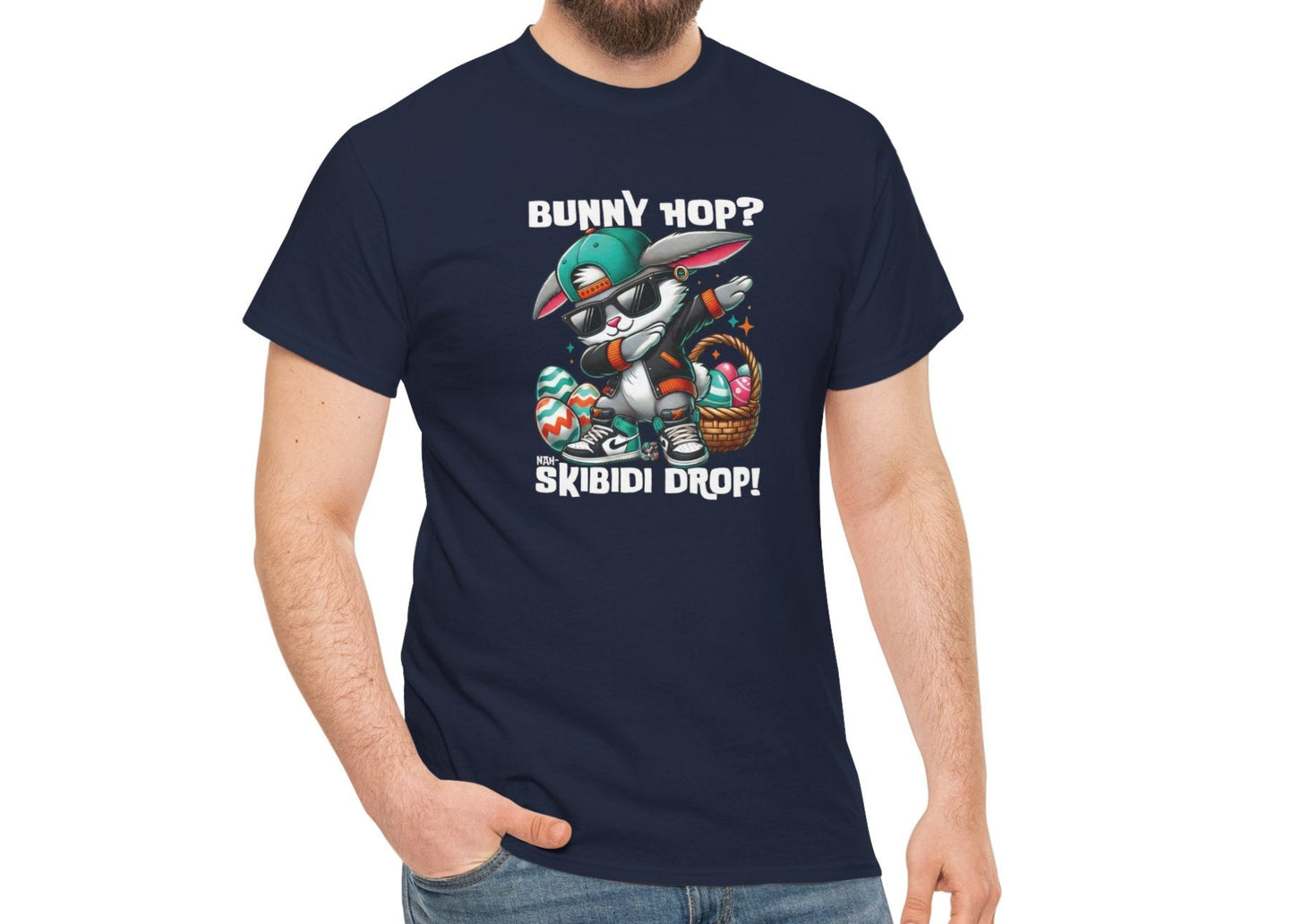 Modeled view of a viral meme-inspired T-shirt in navy. Showcases a playful dabbing Easter bunny with the phrase "Bunny Hop? Nah, Skibidi Drop!" A must-have for those who embrace skibidi sigma vibes. Part of the Vivid Divergence Sensory Friendly Unisex Tees Range.