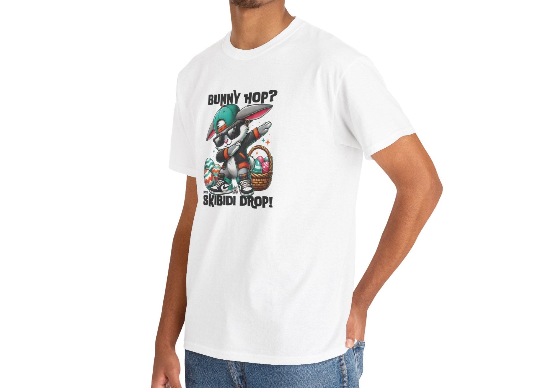 Modeled view of a viral meme-inspired T-shirt in white. A casual and fun tee with a dabbing Easter bunny and "Bunny Hop? Nah, Skibidi Drop!" design. A must-have for Easter with peak skibidi rizz energy. Part of the Vivid Divergence Sensory Friendly Unisex Tees Range.