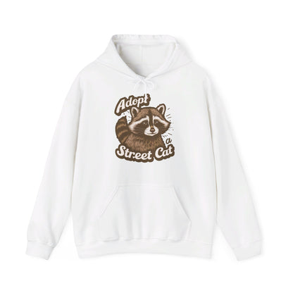 Front view of a white hoodie with the text "Adopt a Street Cat" and a cartoon illustration of a raccoon holding a cup. Part of the Vivid Divergence Sensory Friendly Unisex Hoodie Range.