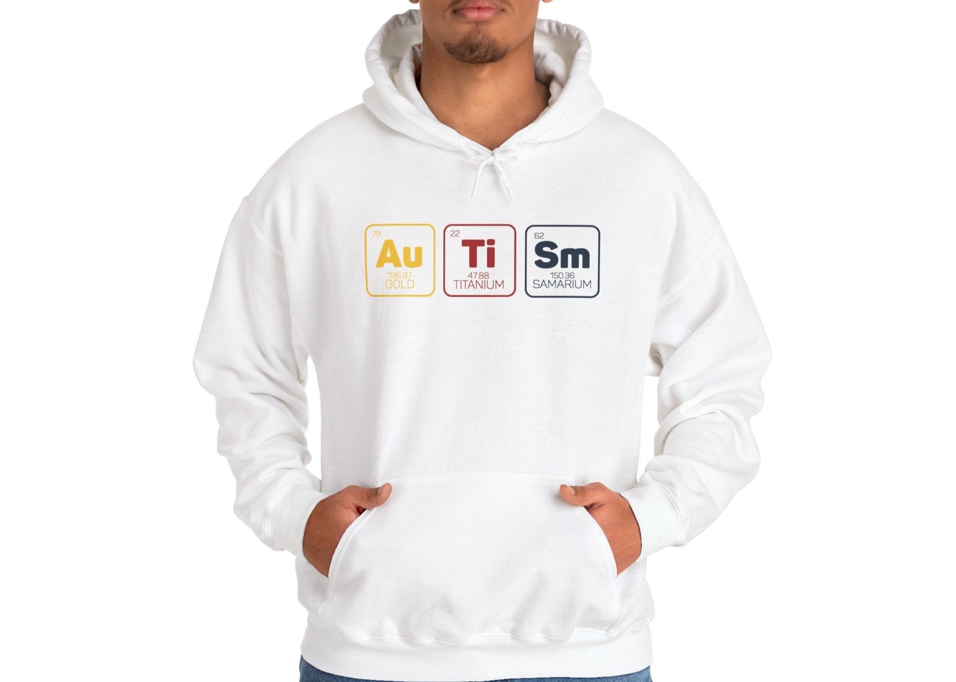 Model wearing a white hoodie with the periodic table design spelling "Autism," highlighting elements Au, Ti, and Sm. Part of the Vivid Divergence Sensory Friendly Unisex Hoodie Range.