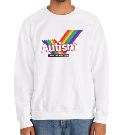 Model wearing a white sweater jumper with an "Autism" Skittles brand parody design featuring rainbow stripes. Part of the Vivid Divergence Sensory Friendly Unisex Sweater Jumper Range.