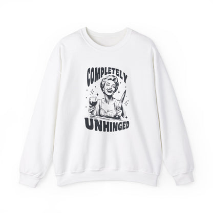 Front view of a white sweatshirt featuring a graphic of a woman holding a knife and a glass of wine with the text "Completely Unhinged." Part of the Vivid Divergence Sensory Friendly Unisex Sweater Jumper Range. 