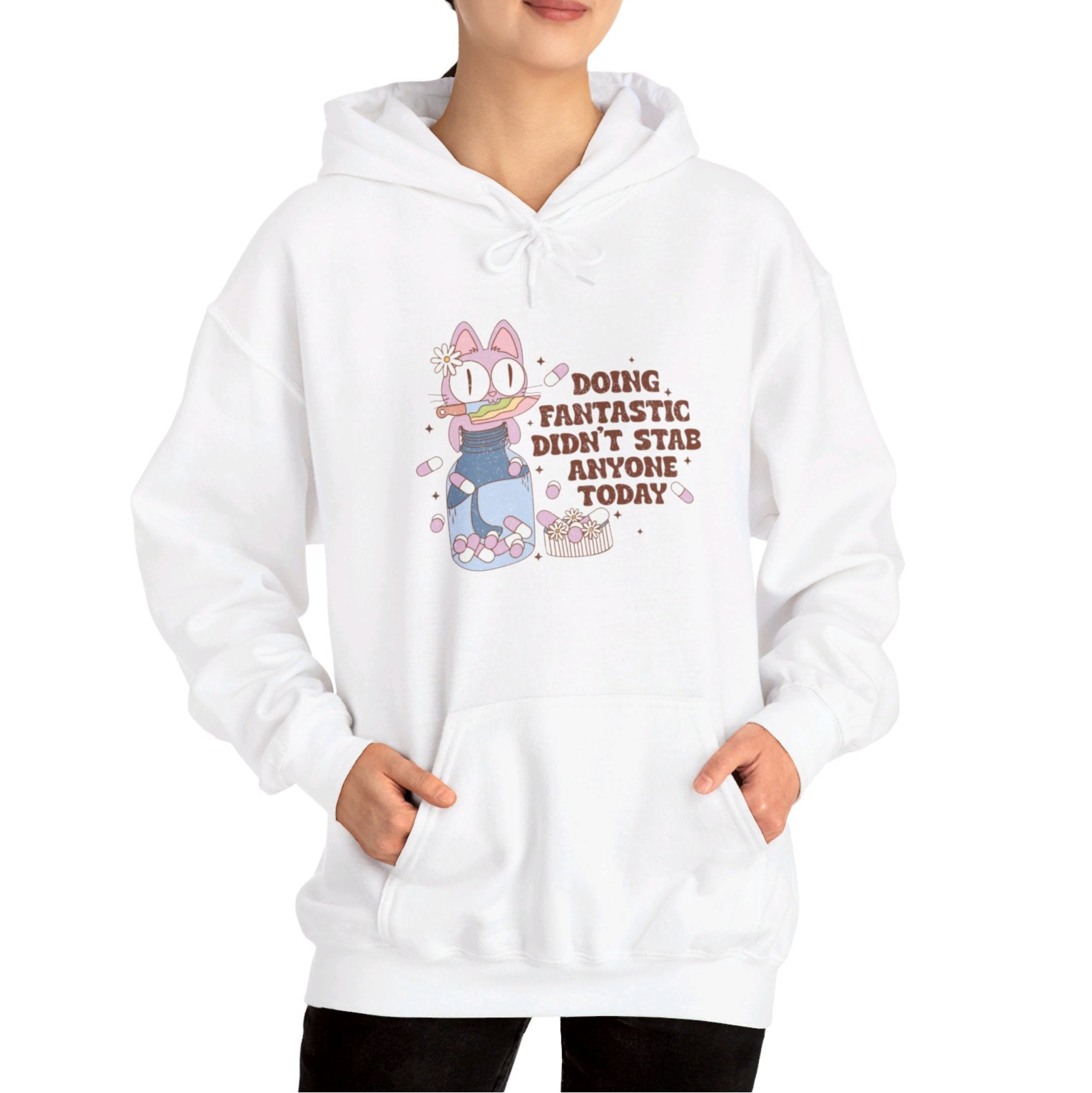 Model wearing a white hoodie featuring the text "Doing Fantastic, Didn’t Stab Anyone Today" and a cartoon illustration of a raccoon holding a knife. Part of the Vivid Divergence Sensory Friendly Unisex Hoodie Range.