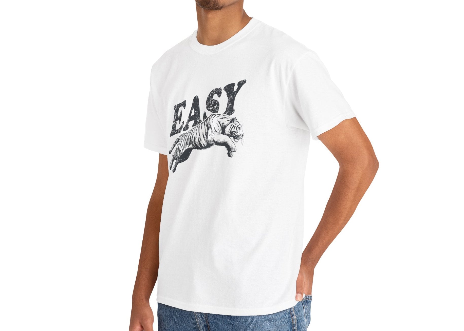 Person wearing a white T-shirt featuring the text "EASY" and a tiger illustration in black, paired with jeans. Part of the Vivid Divergence Sensory Friendly Unisex Tees Range.