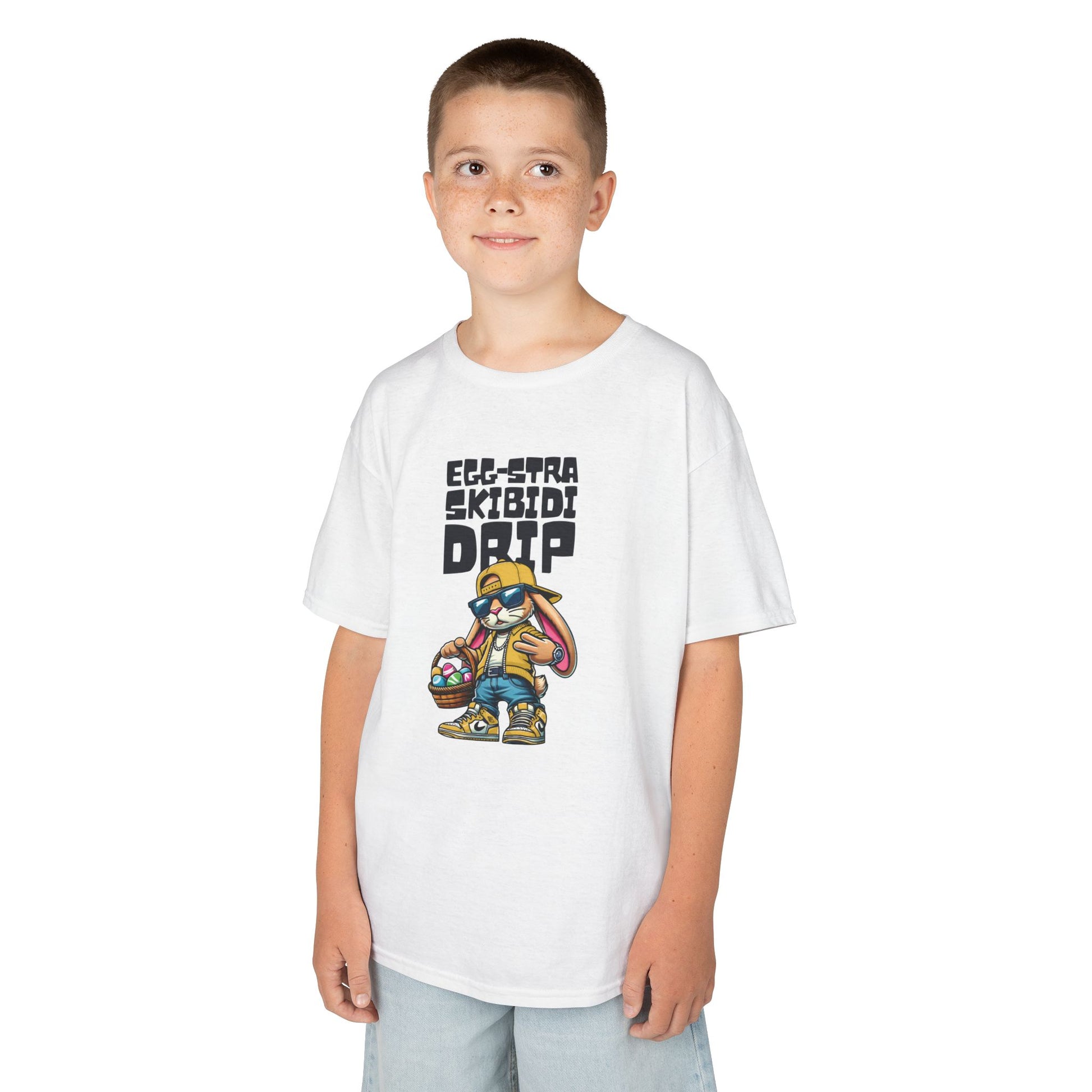 Child wearing a white Easter T-shirt with a Skibidi bunny and "Egg-Stra Skibidi Drip" text, a trendy and fun holiday choice. Hop into the season in style and shop Easter shirts online today!