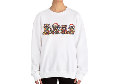 Model wearing a beige sweatshirt featuring a festive illustration of raccoons in Christmas attire causing holiday chaos. Part of the Vivid Divergence Sensory Friendly Unisex Sweater Jumper Range.