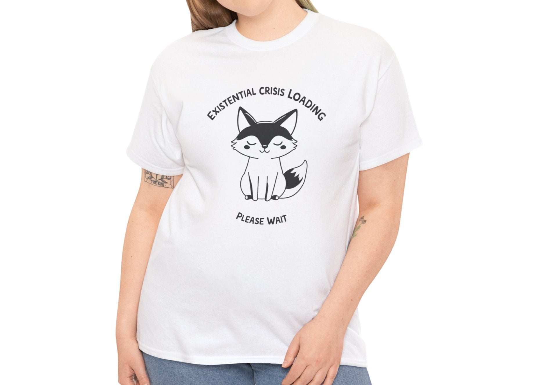 Woman wearing a white T-shirt with a black and white fox graphic and "Existential Crisis Loading, Please Wait" text. Part of the Vivid Divergence Sensory Friendly Unisex Tees Range.
